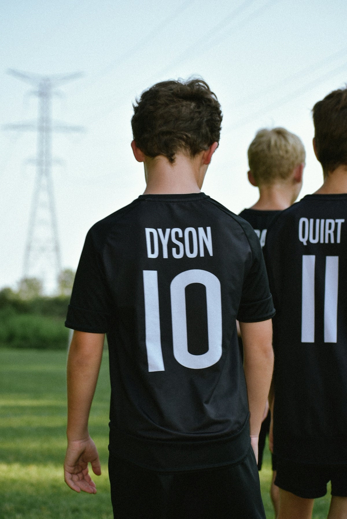 a group of boys in black shirts
